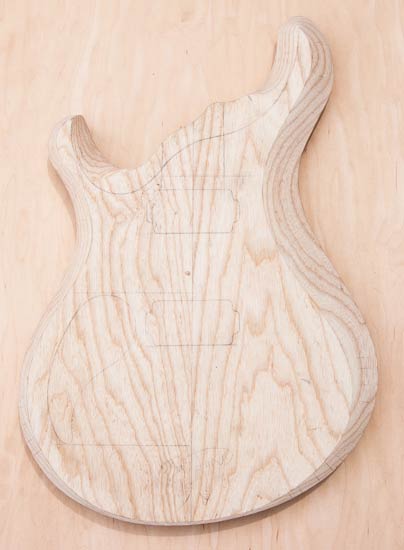 Swamp ash custom guitar body with Stratocaster-inspired shape