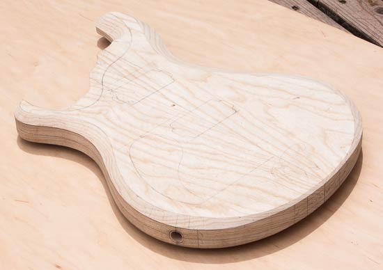 Swamp ash guitar body, double-cutaway design