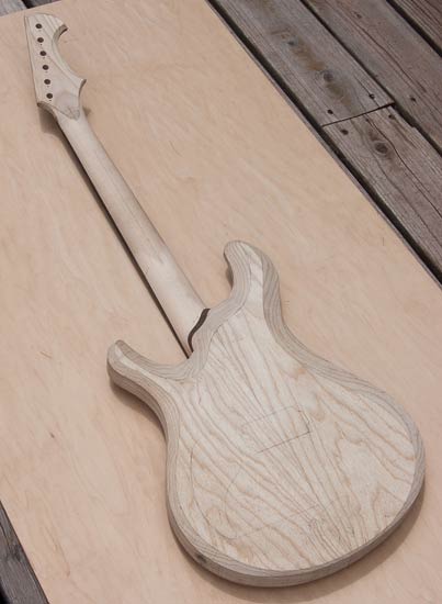 Swamp ash electric guitar with Knaggs body shape