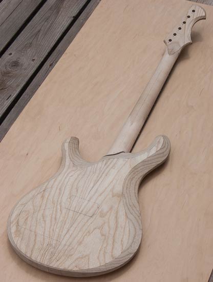 6-string guitar with contoured body and neck heel
