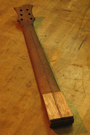 Black walnut guitar neck with limba neck shim