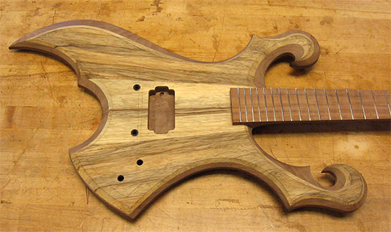 Custom guitar with two scrolls in playing position
