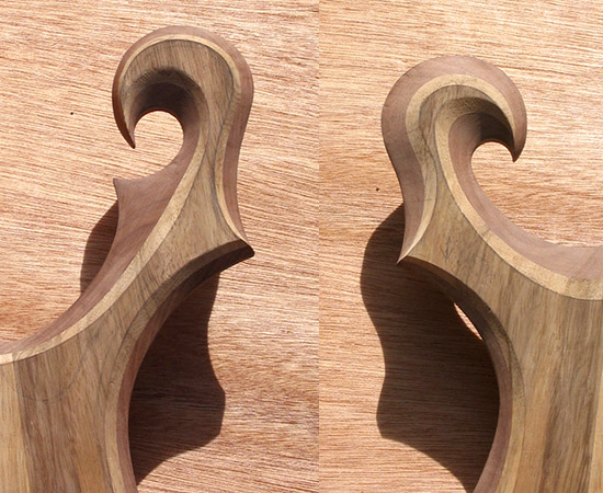 Carved scrolls of a custom guitar with very unique shapes